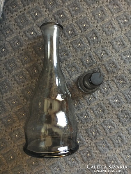 Black vintage glass bottle with original stopper