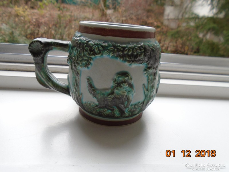 Decorative hunter's cup with raised tree, flower and animal patterns with green tones