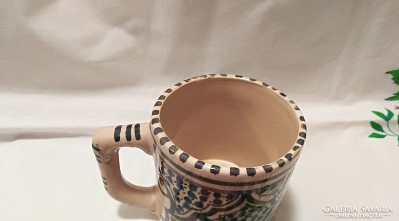 Folk ceramics, including a Corundian vase, in mixed quality (the lid of the cup falls off)