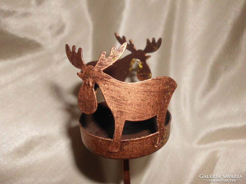 Reindeer decorated candle or candlestick.