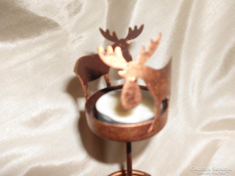 Reindeer decorated candle or candlestick.