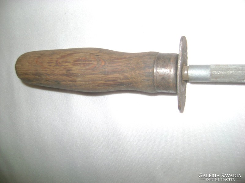 Sharpening knife with old wooden handle