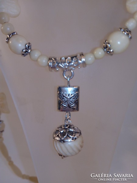 Bone necklace with butterfly carving (554)
