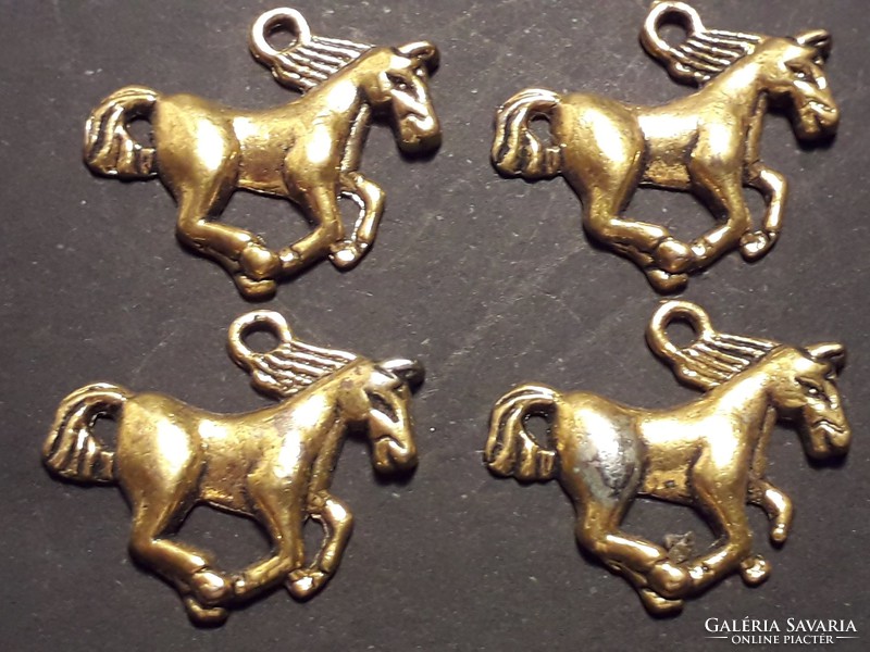 A metal pendant with a horse, a gift idea