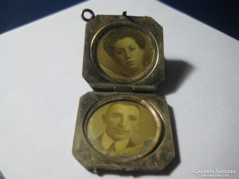 Antique openable copper shell pendant, probably containing photos of the former young couple