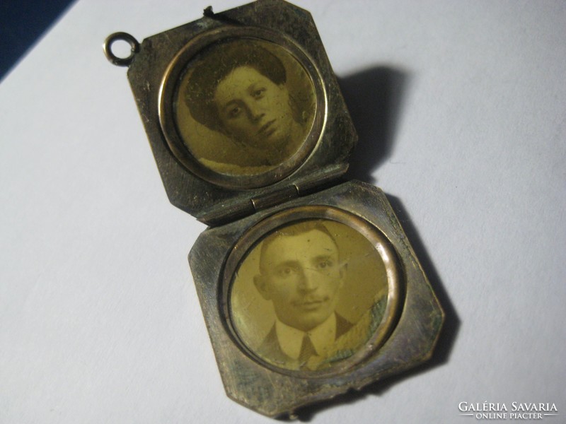 Antique openable copper shell pendant, probably containing photos of the former young couple