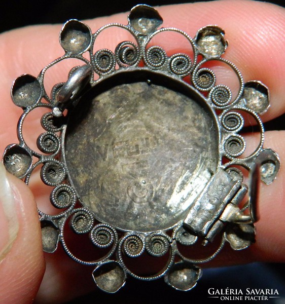 Antique filigree silver brooch with symbols