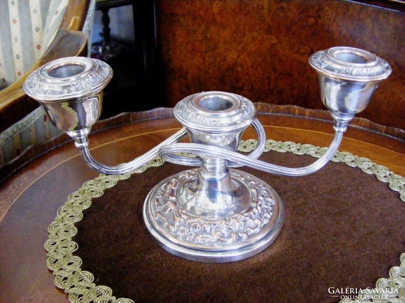 Silver-plated, plastic patterned, three-pronged, elegant candle holder to enhance the festive atmosphere