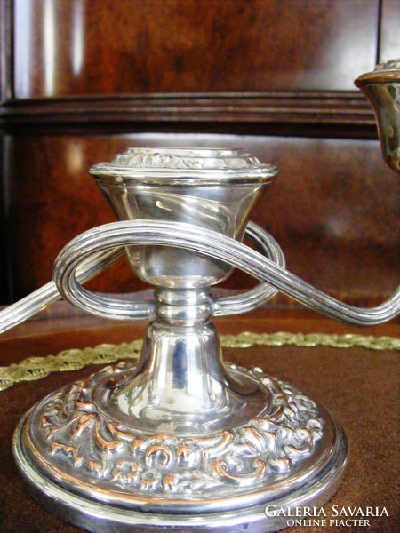 Silver-plated, plastic patterned, three-pronged, elegant candle holder to enhance the festive atmosphere