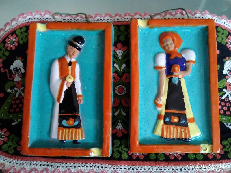 Jolán Szécsi's wall-hanging ceramic pictures in folk costume, with markings.