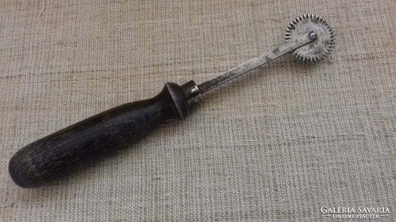 Old leather rádli with wooden handle