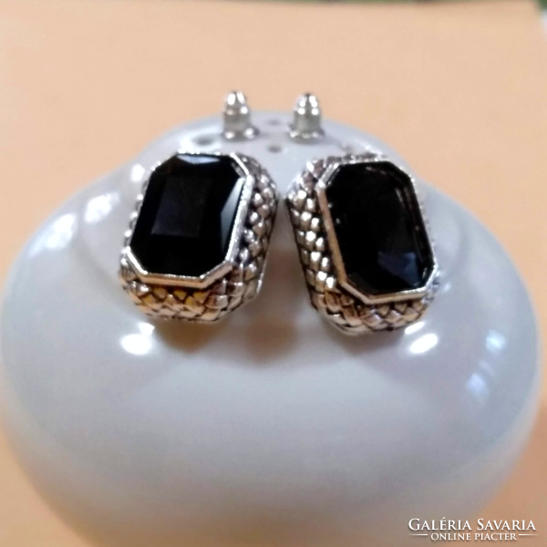 Black faceted stone earrings in a silver socket