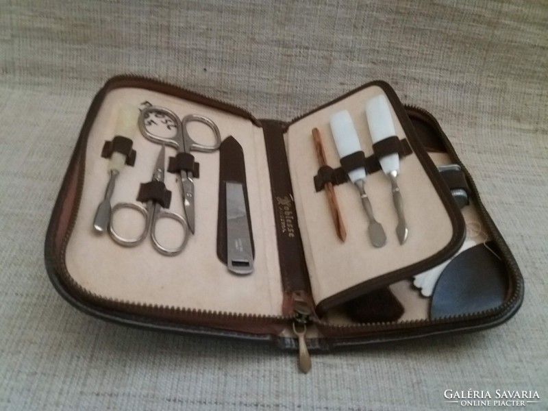 Old marked manicure and sewing set in leather case