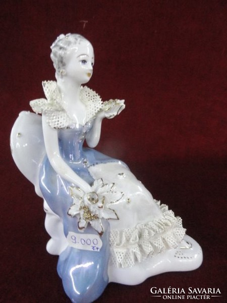 Porcelain figurative statue of Stipo Dorohoi. The princess is in a light blue lacy dress. He has!