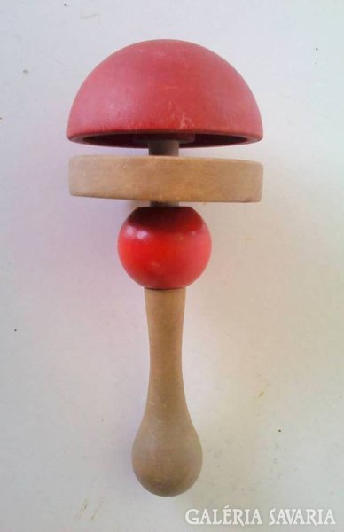 Old wooden children's rattle and hitchhiking tree