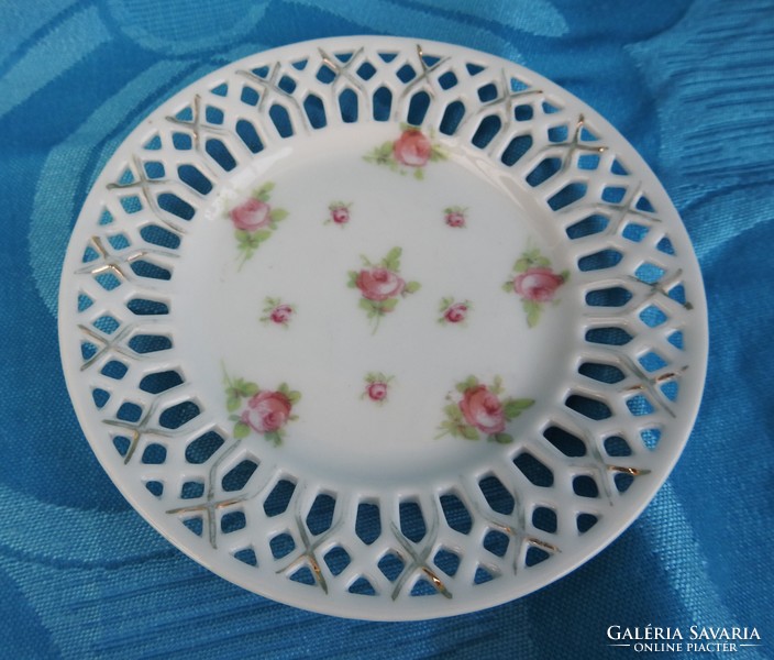 A small rose-painted bowl with an openwork basket pattern on the edge