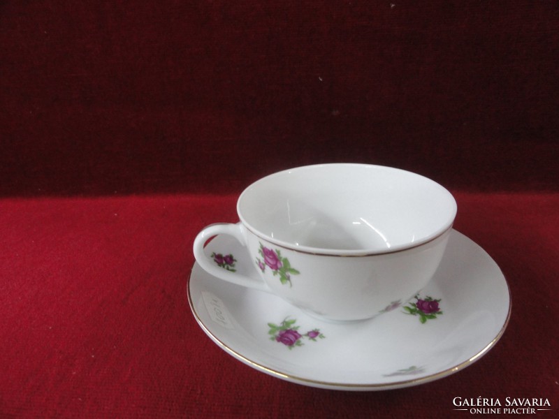 Chinese porcelain teacup + placemat with small purple flowers on a snow-white background. He has!