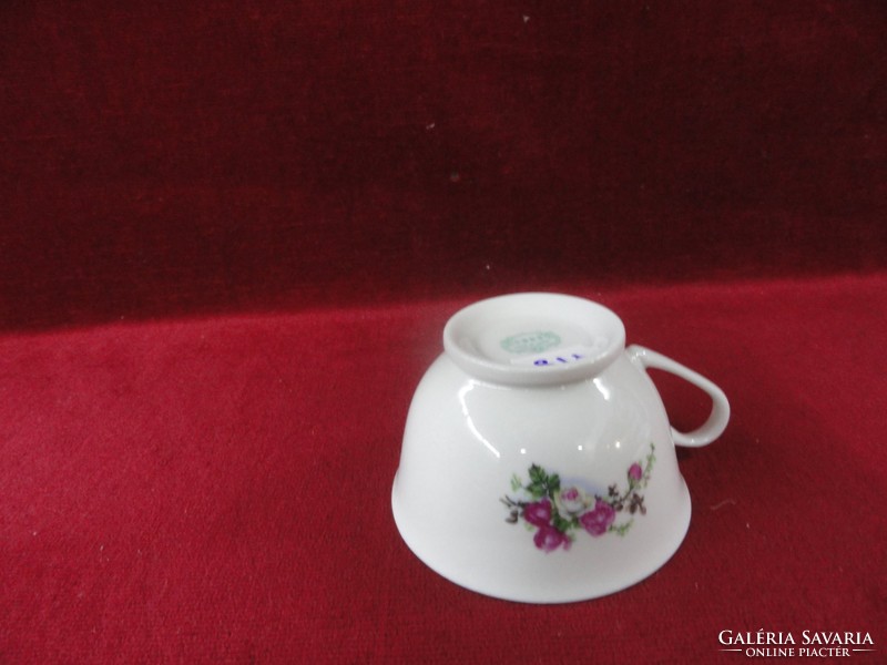 Porcelain tea cup decorated with a wonderful bouquet of roses. He has!
