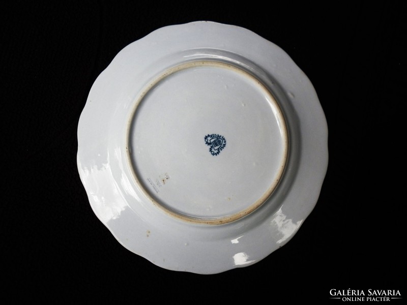 A pair of Zsolnay plates with a heart seal and monogram