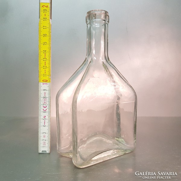 Colorless, medium-sized, concave-sided liquor bottle (854)