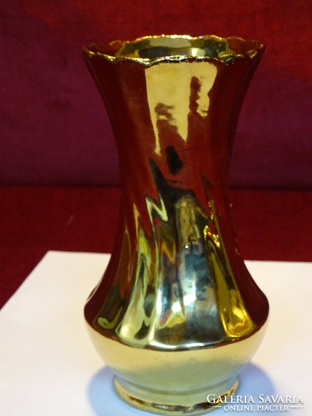 Porcelain gilded vase, with a convex rose pattern, 15 cm high. He has!