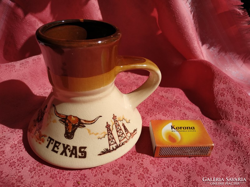 An interesting ceramic jug with a Texas handle