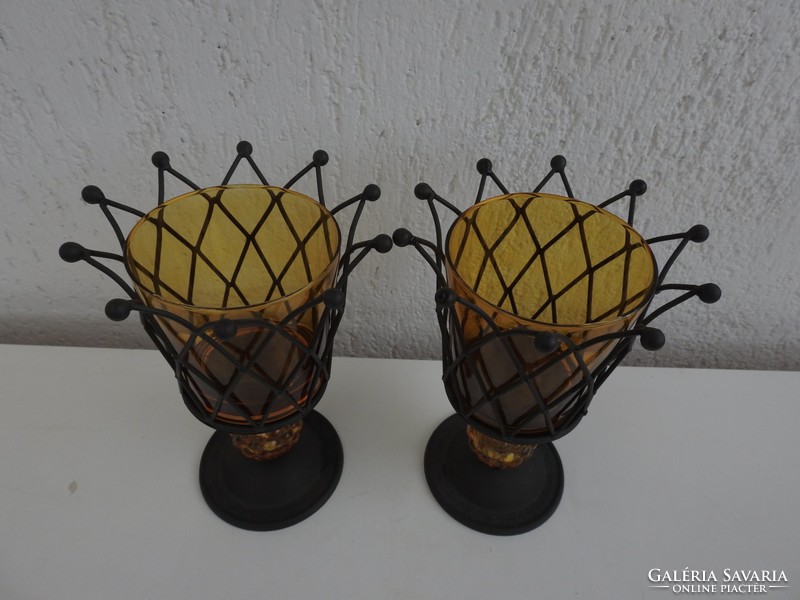 A pair of decor cups with an impressive crown design and a mustard colored glass insert