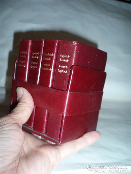 Set of 4 leather-bound dictionaries