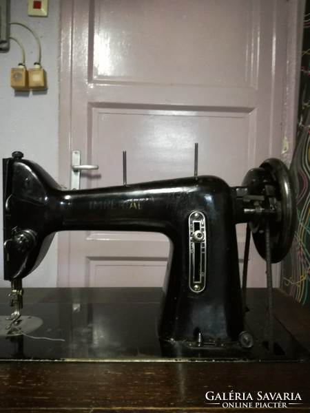 Cabinet sewing machine with spare parts and user manual