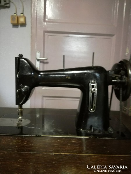 Cabinet sewing machine with spare parts and user manual