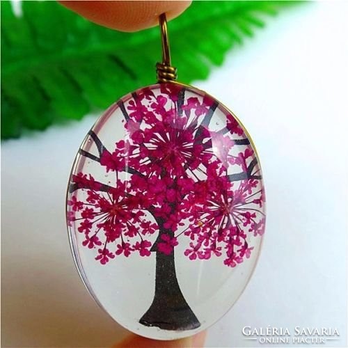 Enclosed in a special unique tree of life crystal pendant!