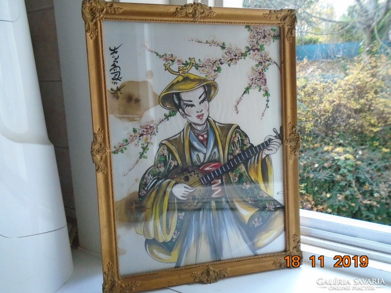 Portrait of a young lady playing music with a calligraphic sign in a Vietnamese painting on silk in a blonde frame