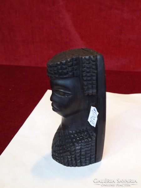 African wooden statue depicting a man, height 13.5 cm. He has!