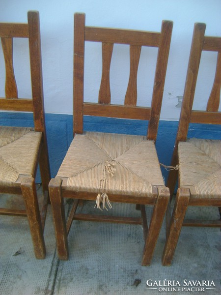 Three old wicker chairs together
