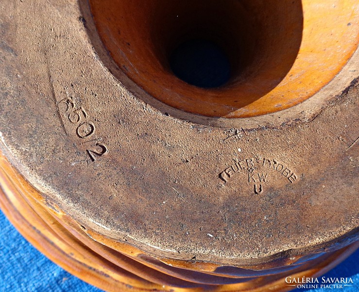 Old marked ceramic cookware in oven shape