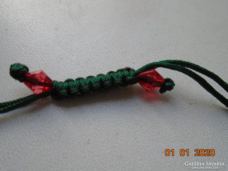 Red currant-colored glass beads, crocheted with a green cord, bracelet