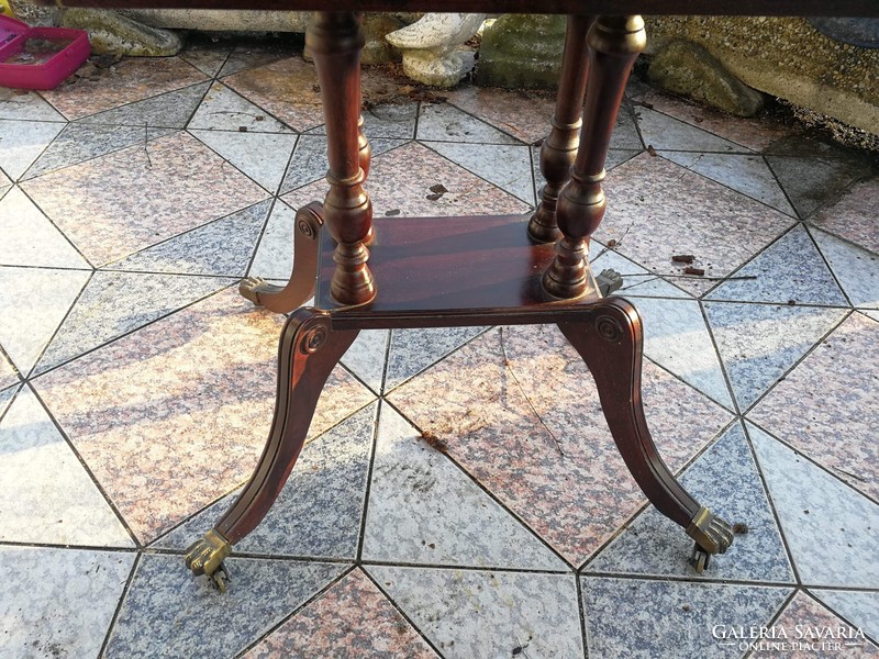 Old table with 2 drawers, a graceful piece of copper with lion's claw castors