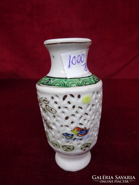 Oriental porcelain mini dry flower vase with pierced sides with embossed bird pattern. He has!
