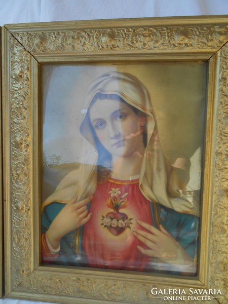 A pair of holy pictures in a golden frame