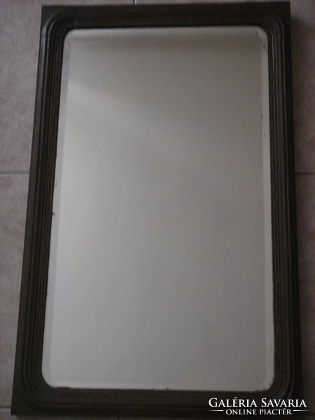 Large wall-mounted wooden mirror