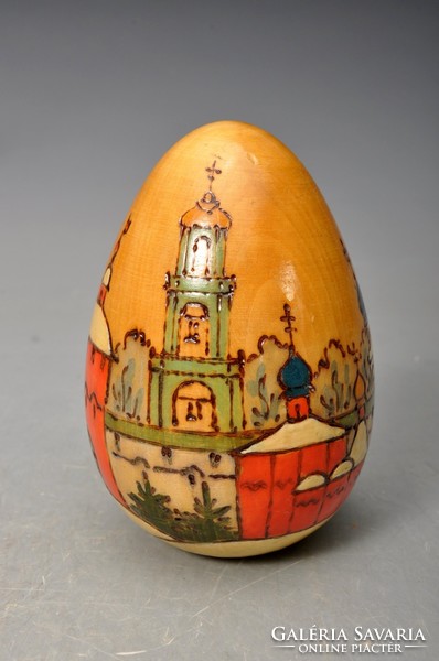 Antique hand painted Russian lacquered wooden egg with the image of orthodox churches.