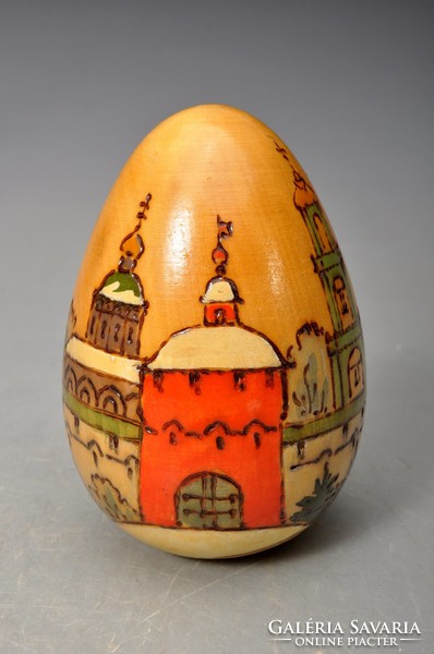 Antique hand painted Russian lacquered wooden egg with the image of orthodox churches.