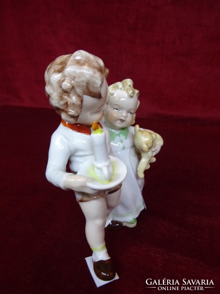 German porcelain figural sculpture, children's couple with teddy bear and candle. He has!