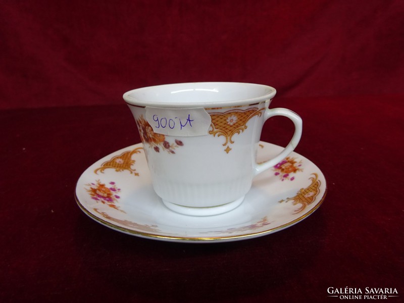 Oriental porcelain coffee cup + placemat, so far standing in a display case. He has!