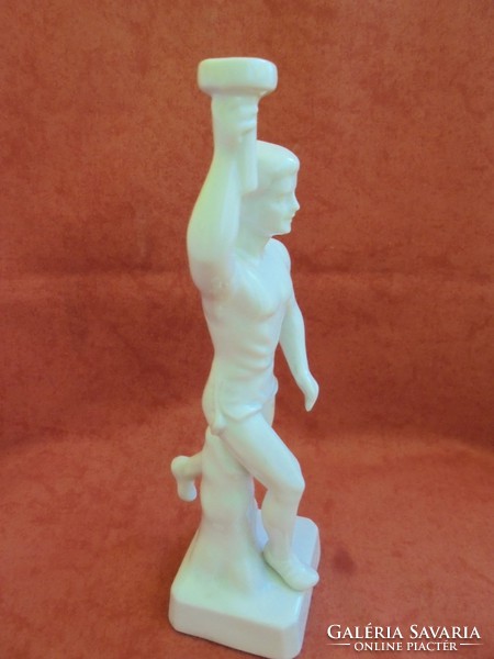 Porcelain statue holding a rare raven house Olympic flame