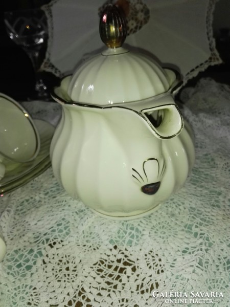 3 Personal tea set...On a bone-colored base with rose gold decoration.