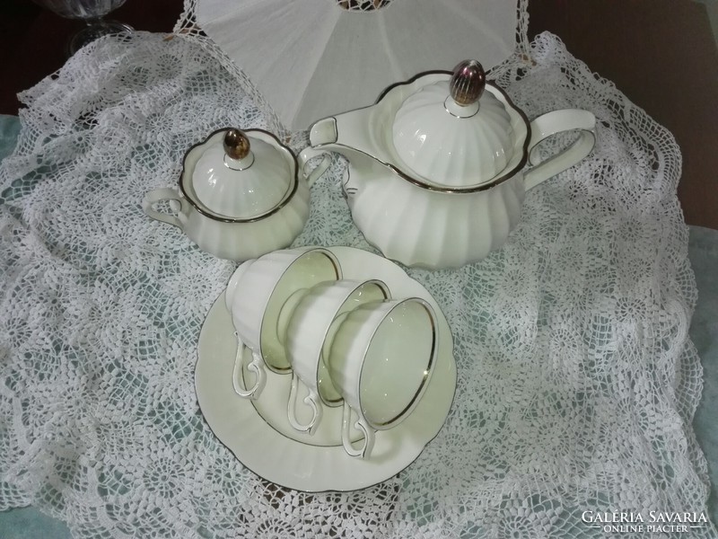 3 Personal tea set...On a bone-colored base with rose gold decoration.