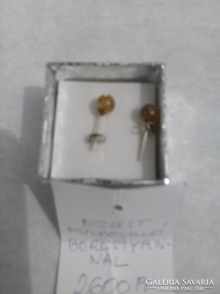 Small round amber earrings with silver sockets for sale.