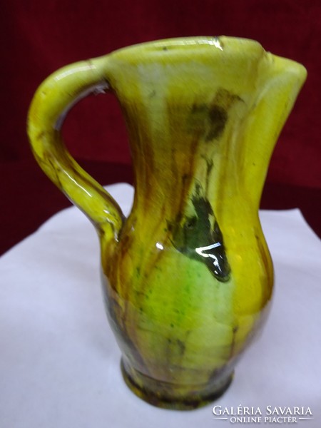 Glazed ceramic jug, height 10 cm. He has!
