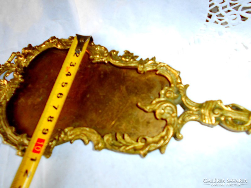 Baroque copper mirror frame with putto figure